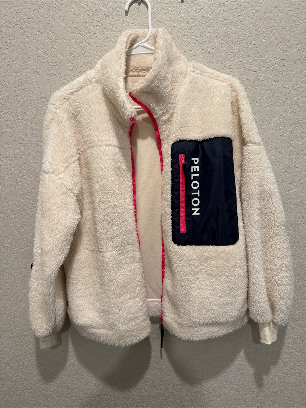 Peloton Cream Teddy Sherpa Jacket with Navy Chest Pocket and Pink Trim